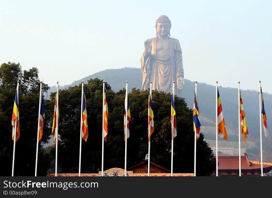 Flags in fromt of Buddha