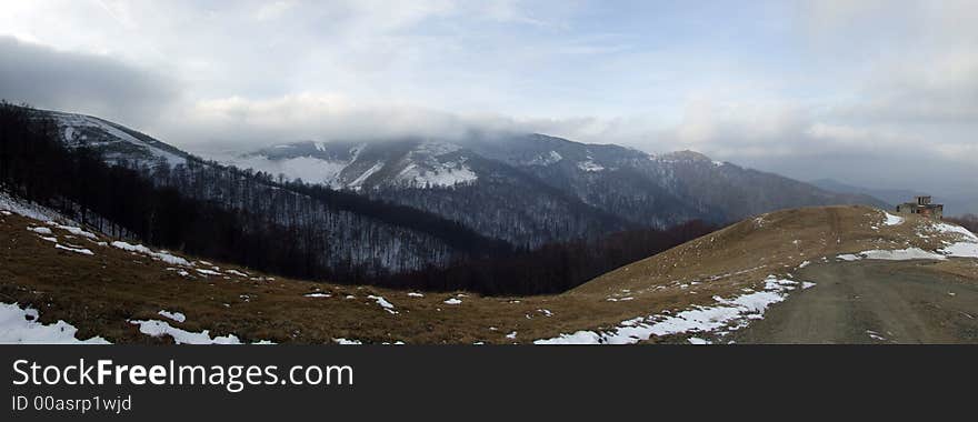 Panoramic picture of mountains with clouds floating near the mountain top. Panoramic picture of mountains with clouds floating near the mountain top