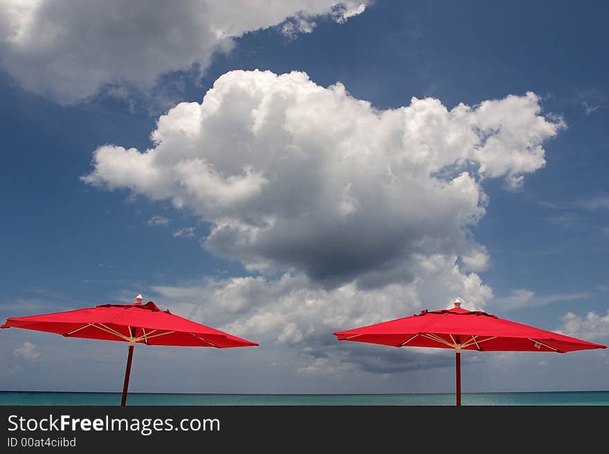 Beach Umbrellas And Clouds