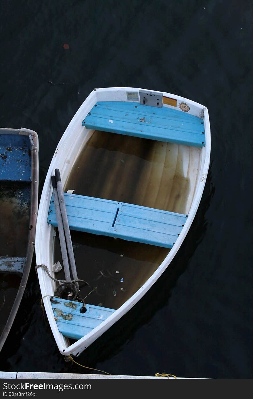 Dingy flooded with water after a storm