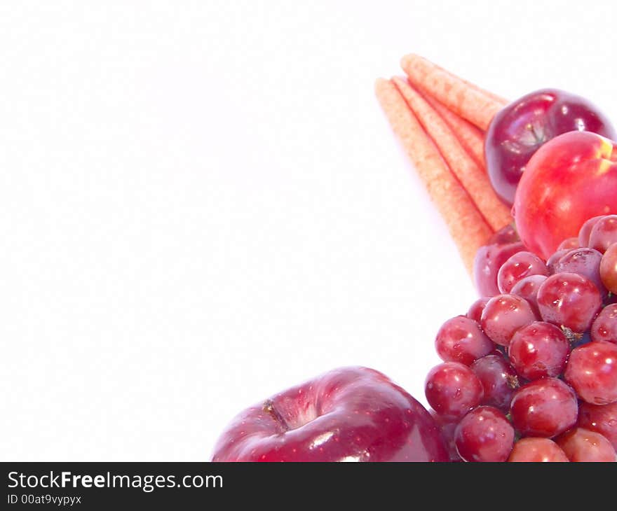 A bunch of fruit and vegetable, including, carrot, apple, apricot and grapes