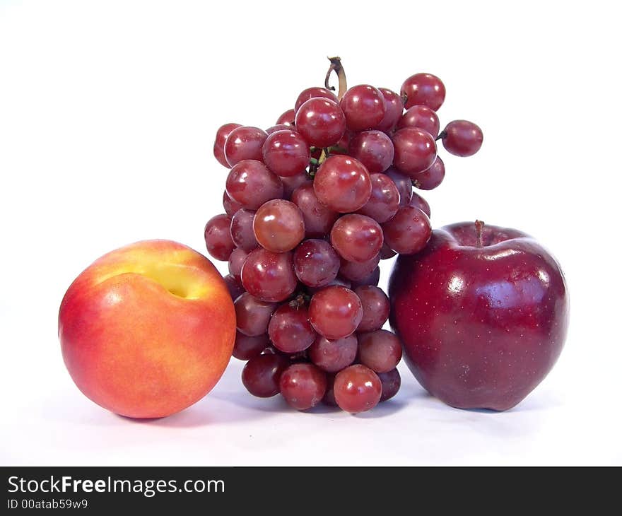 A bunch of fruit, including, apple, apricot and grapes