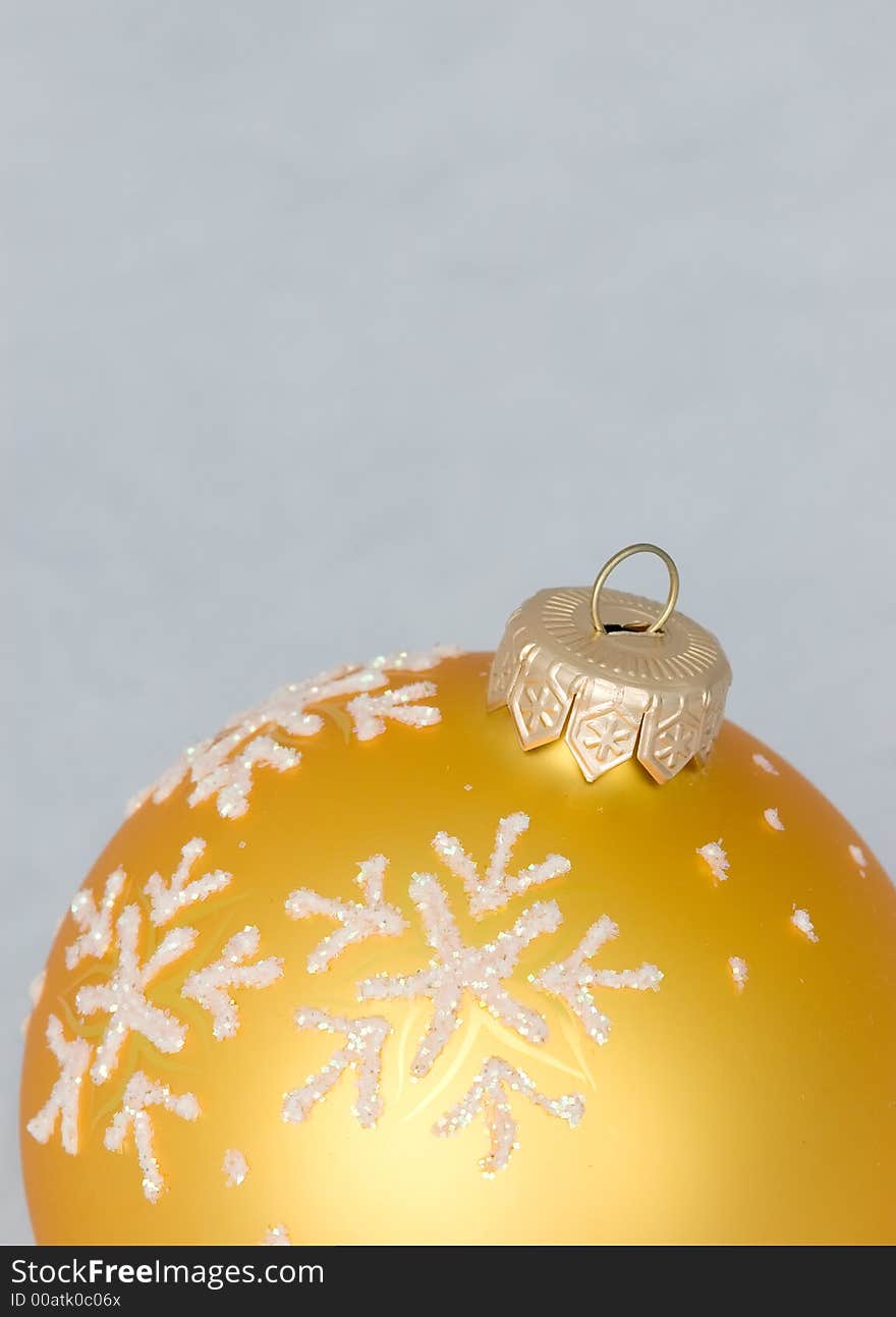 New year toy - bright yellow ball on white background. New year toy - bright yellow ball on white background