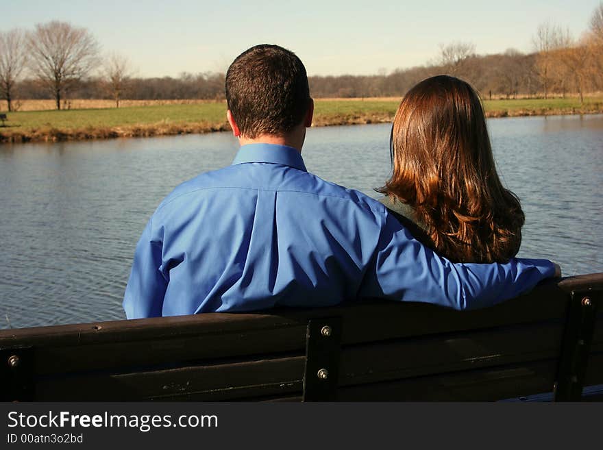 Young couple on park bench. Young couple on park bench