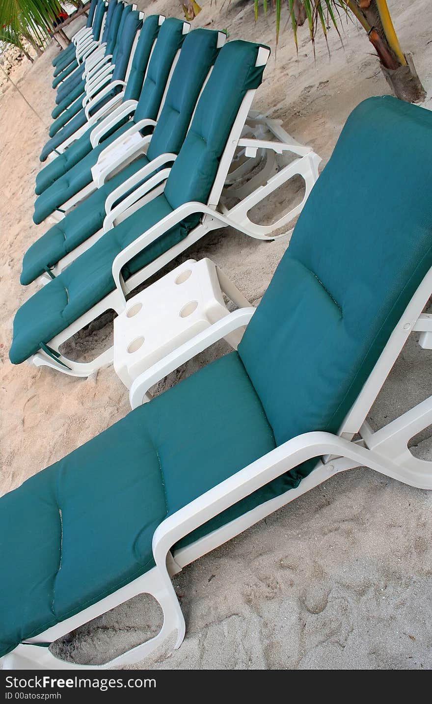 Row of green beach chairs