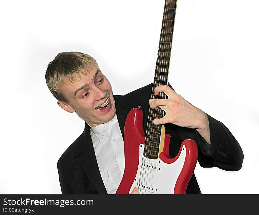 Guy blonde with a red guitar. Guy blonde with a red guitar