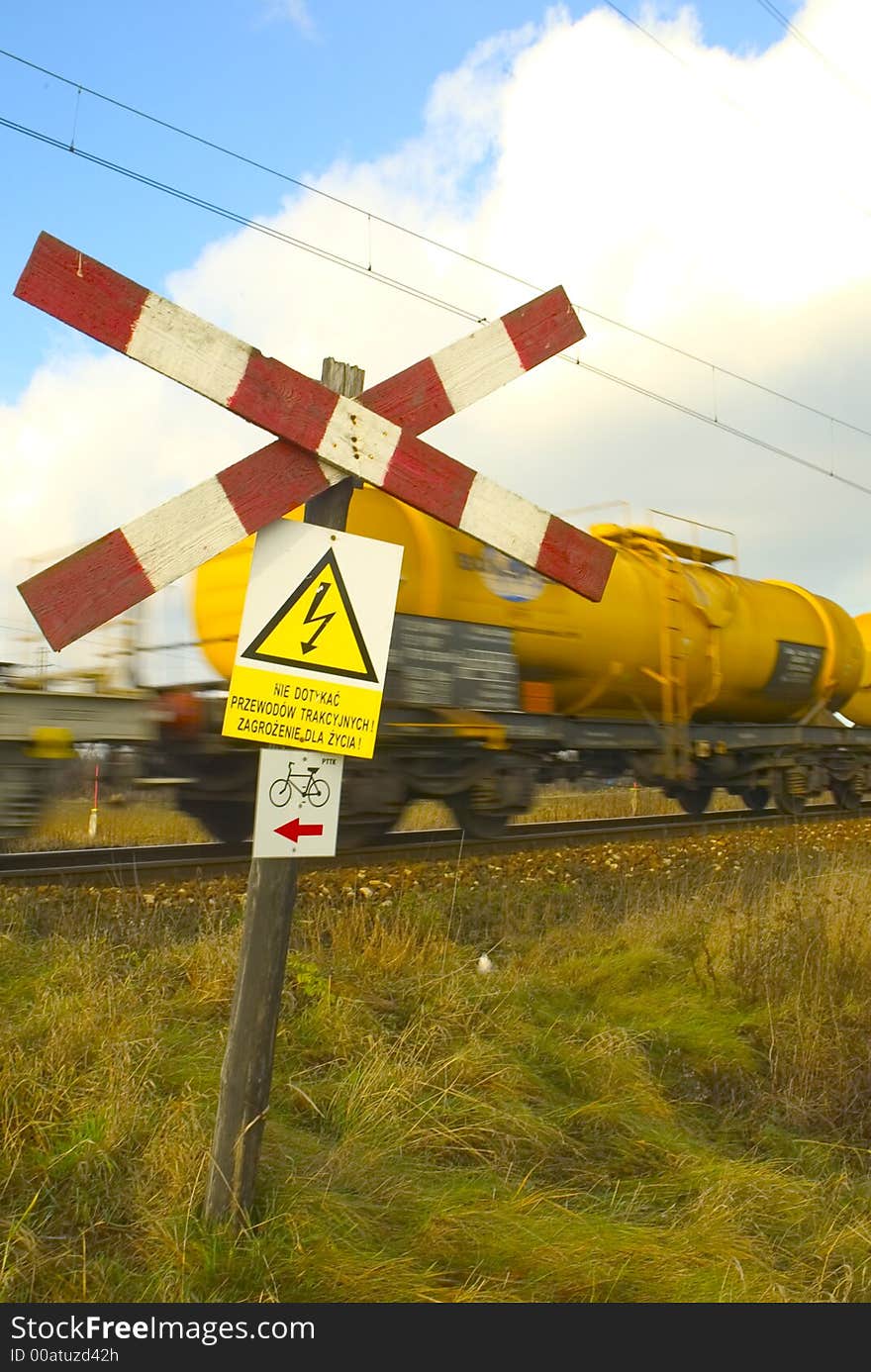 Beware sign next to railway track. Beware sign next to railway track