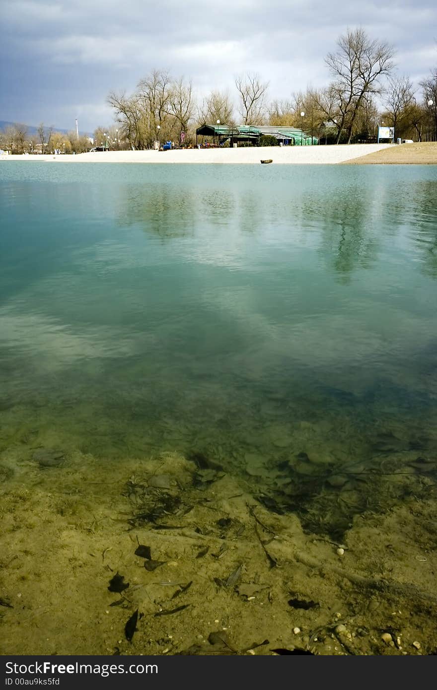 Turquoise lake with coastline