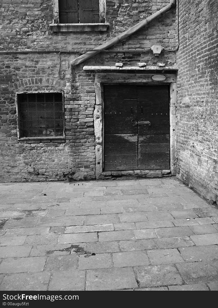 The wooden door of an old house in Venice