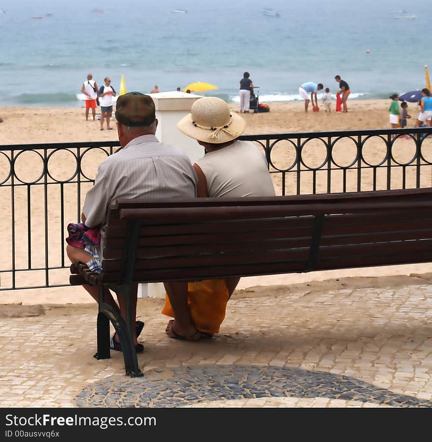 Old couple watching the sea