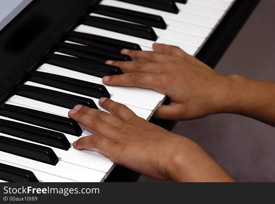 Two hands playing the piano