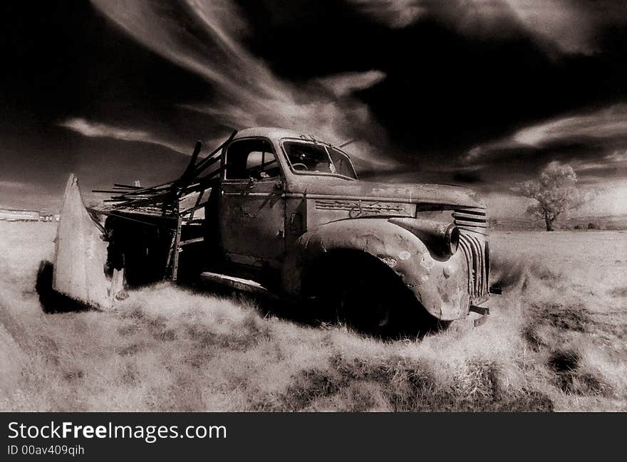 Old derelect truck in barren landscape, infra red. Old derelect truck in barren landscape, infra red