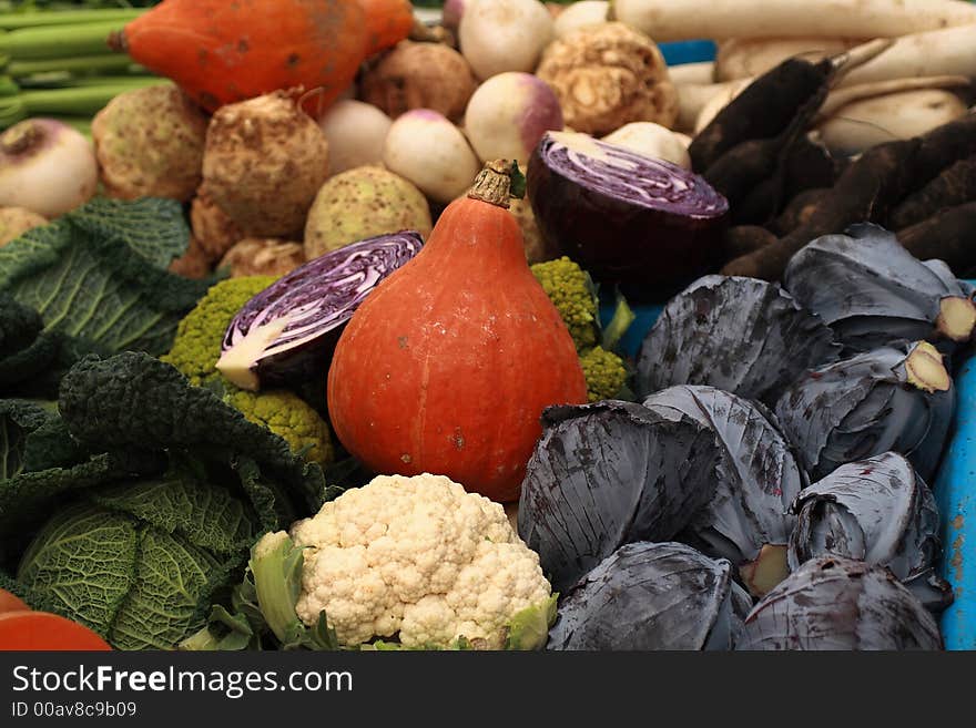 Display of colorful vegetables at a market stall