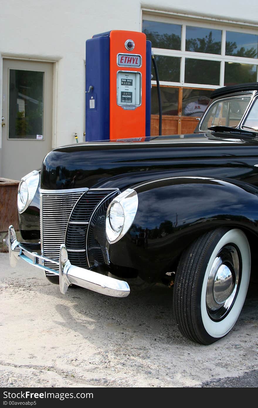 Classic car and old gas pump, nostalgic. Classic car and old gas pump, nostalgic