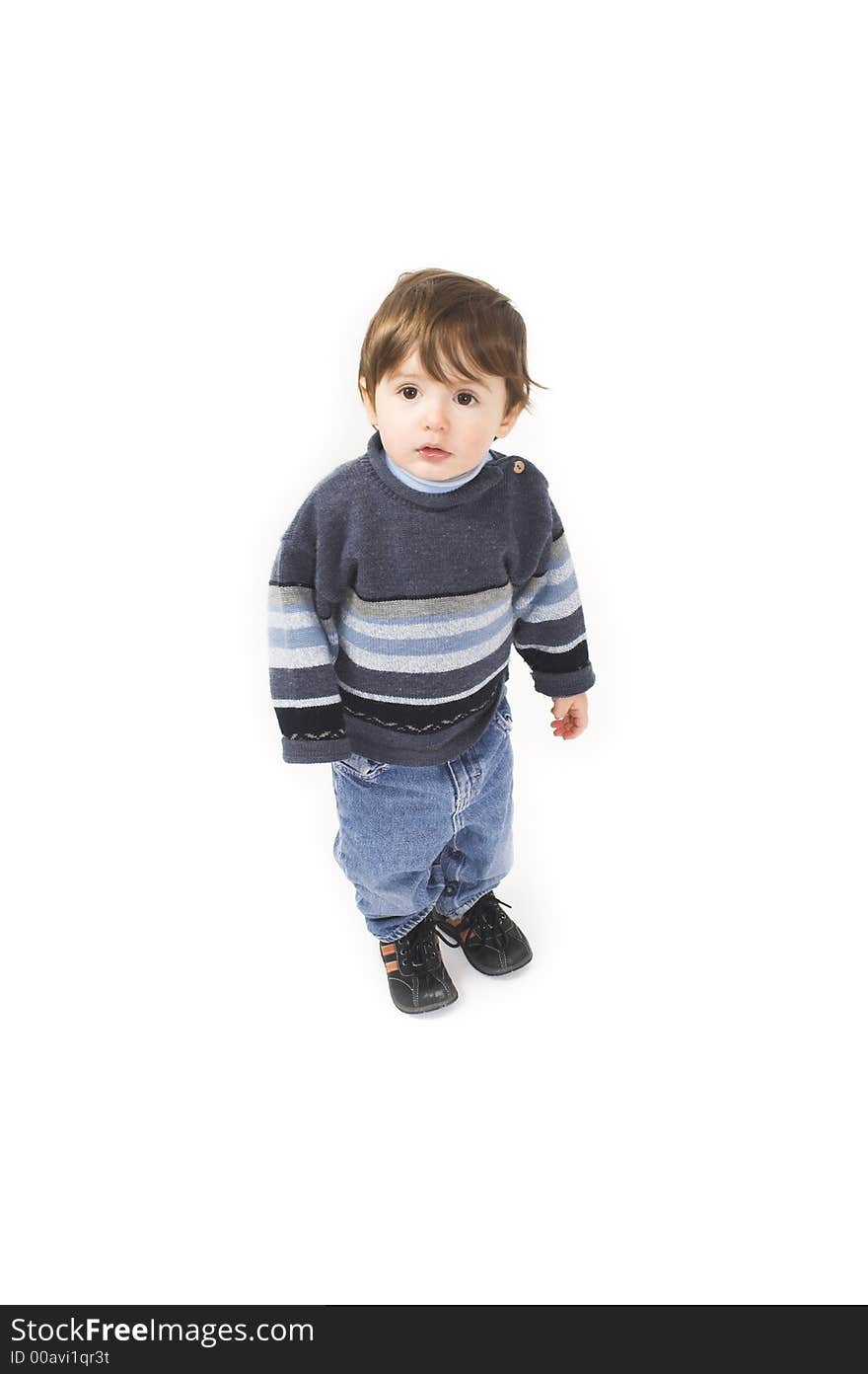 Baby with blue pullover standing over white background. Baby with blue pullover standing over white background