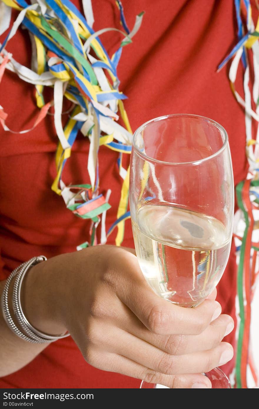 Woman holding glass of champagne over white