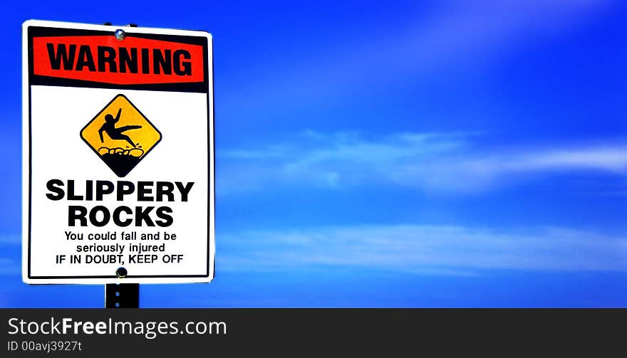 Digital photo of WARNING SIGN with bright blue sky in Hawaii. Digital photo of WARNING SIGN with bright blue sky in Hawaii.