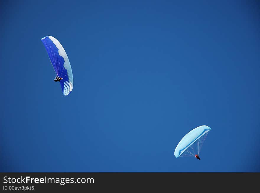 Two paragliders on perfect blue New Zealand sky . Two paragliders on perfect blue New Zealand sky