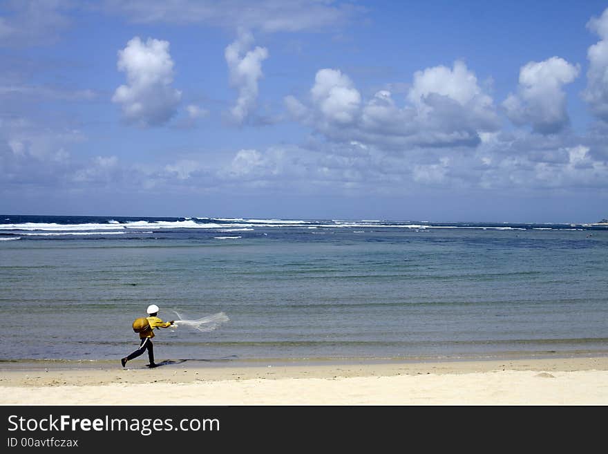 Fisherman by the sandy beach. Fisherman by the sandy beach.