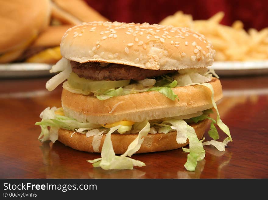 Shot of fast food cheeseburger & fries shot up close. Shot of fast food cheeseburger & fries shot up close