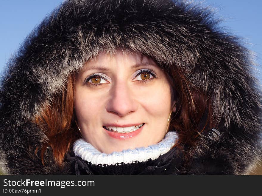 Portrait of woman in winter hooded coat. Portrait of woman in winter hooded coat