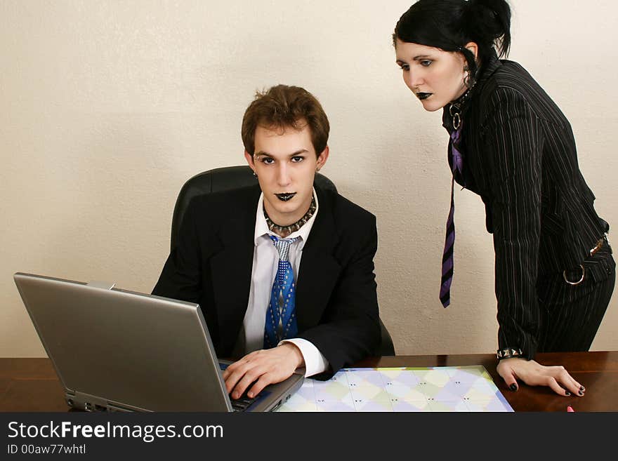 Goth twenty something business team with laptop. Goth twenty something business team with laptop.