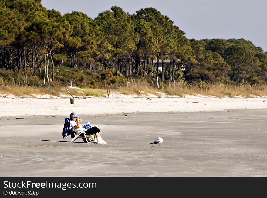 Woman Relaxing On Beach