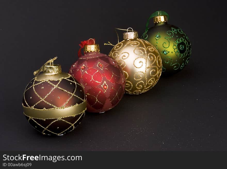 Detail of Christmas balls against a plain background.