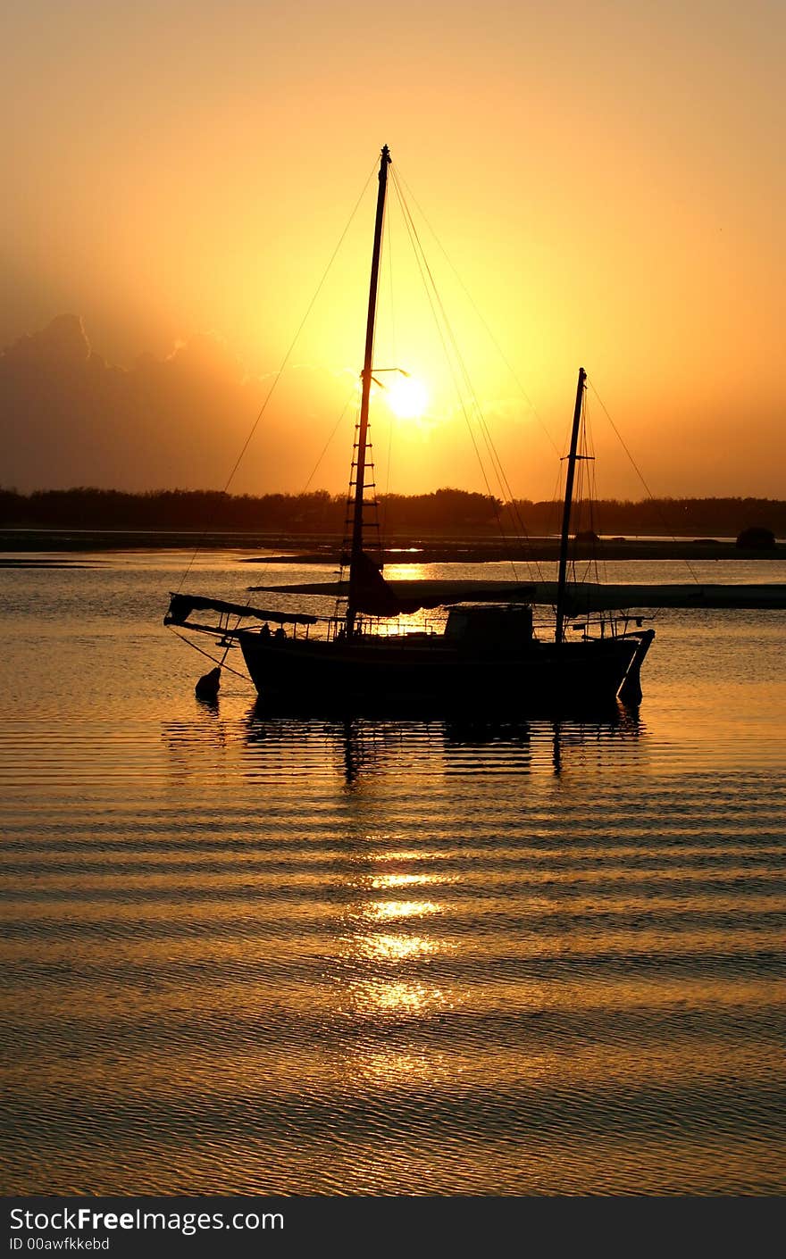 An old vintage ketch at sunrise.