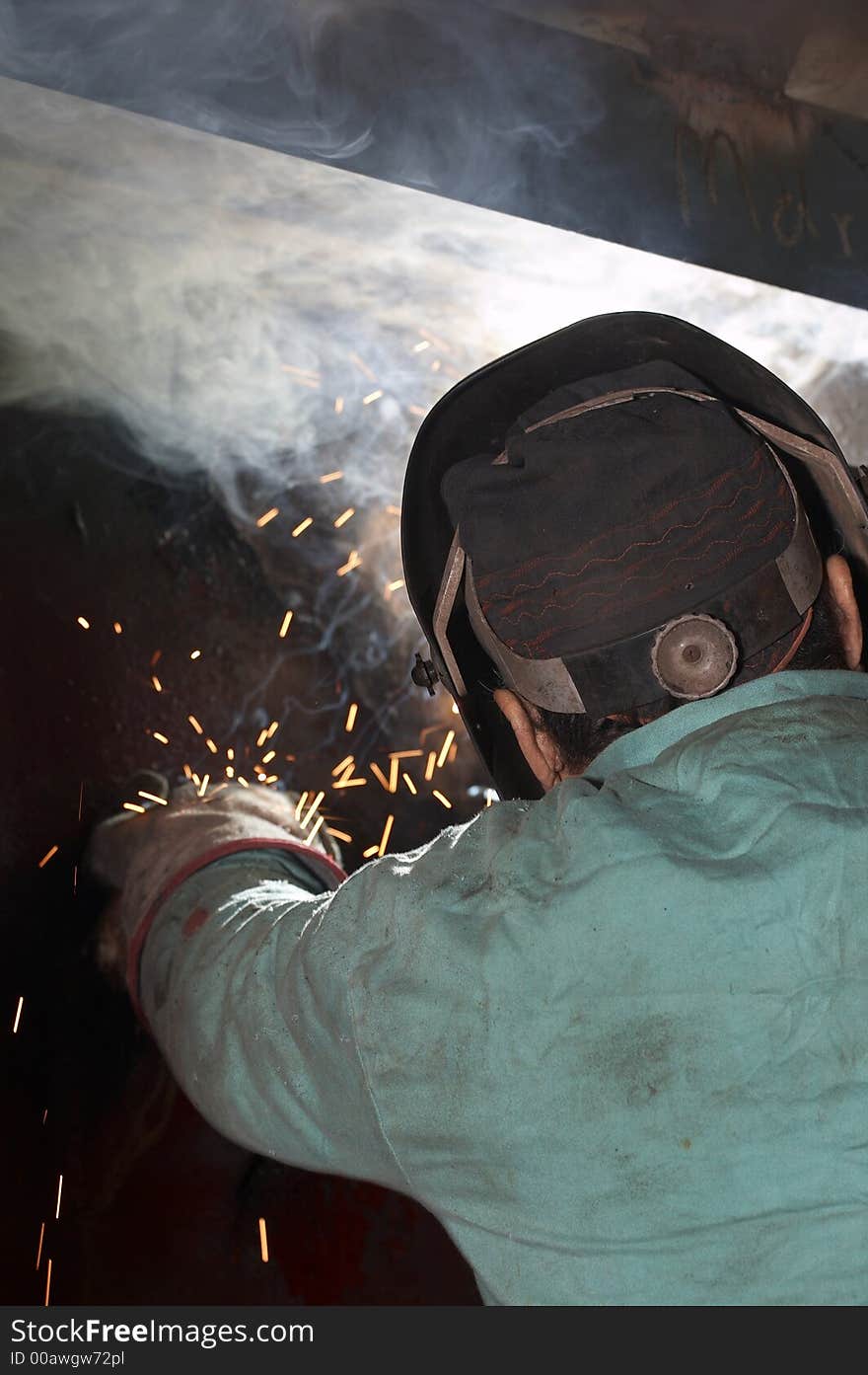 Welder working view from rear