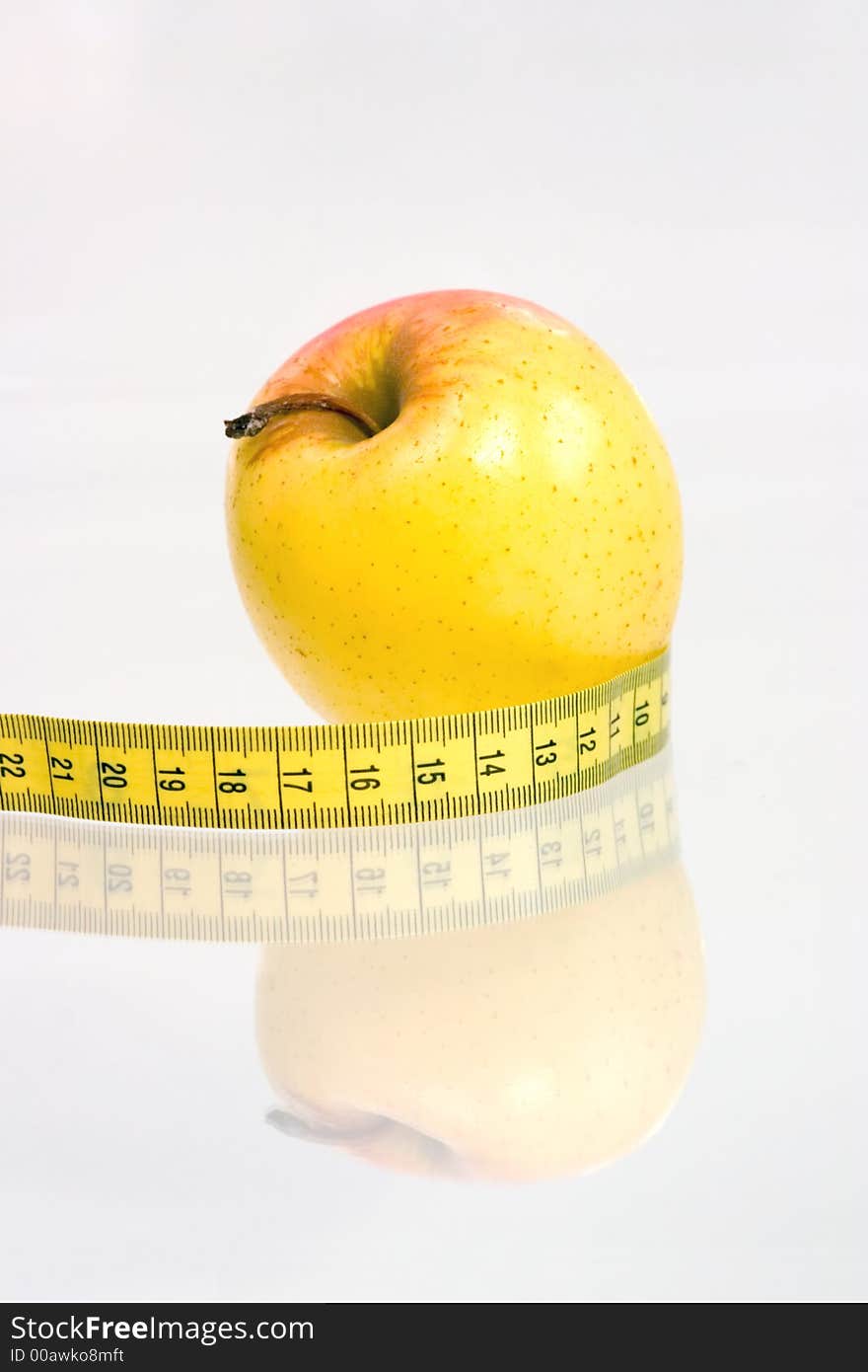 Apple with centimeter on a white background. Apple with centimeter on a white background