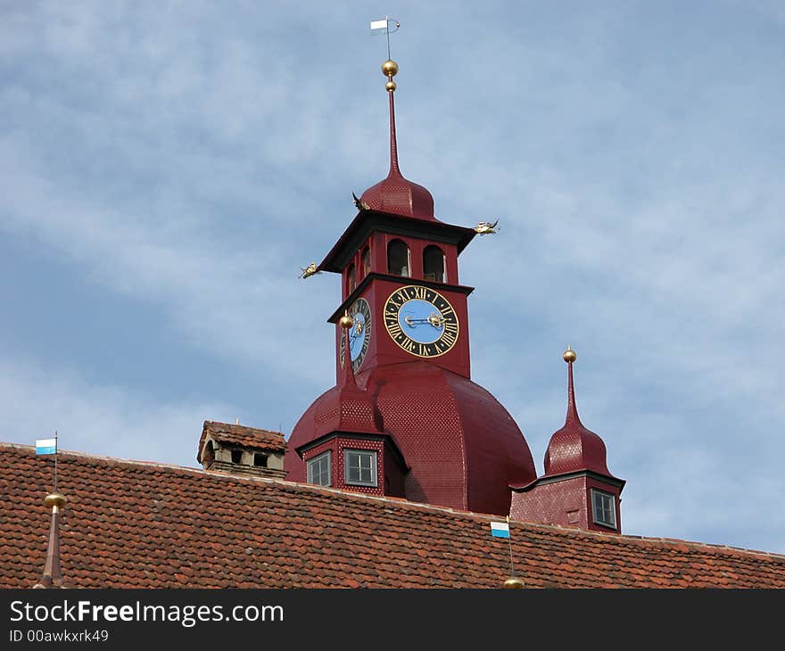 A view of an old church town and clock in the old part of Luceerne Switzerland. A view of an old church town and clock in the old part of Luceerne Switzerland.