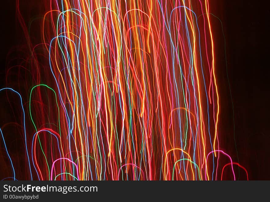 Moving lens photo of christmas tree lights.