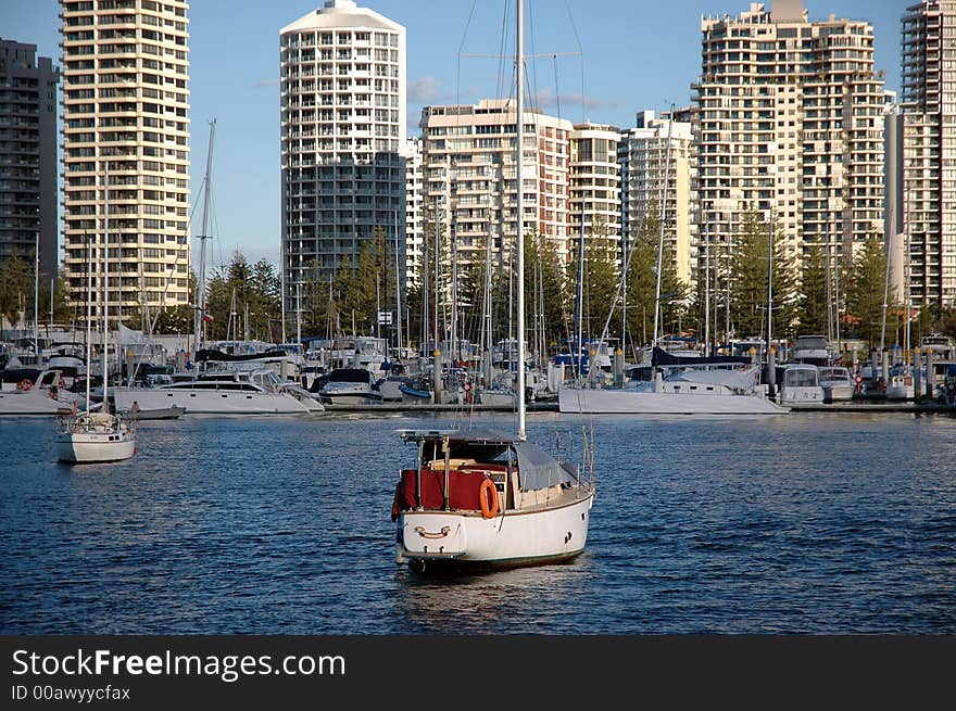 Boats and Yachts againtst apartments background in Main Beach,Gold Coast, Australia. Boats and Yachts againtst apartments background in Main Beach,Gold Coast, Australia.