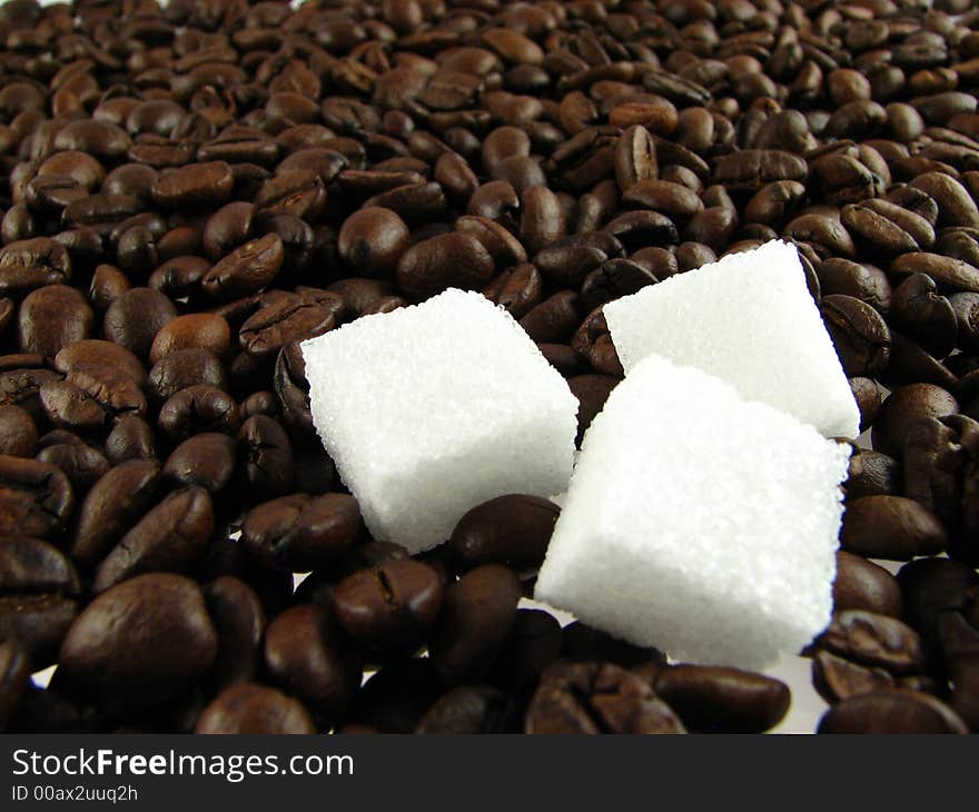 Close-up of coffee beans  with sugar. Close-up of coffee beans  with sugar