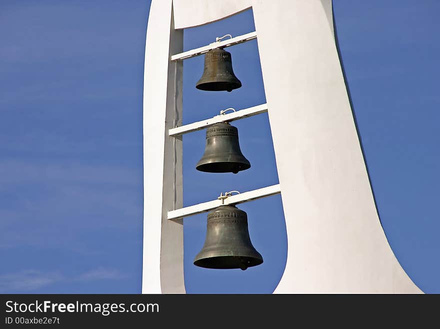 Modern white steeple on a Catholic church - with bells. Modern white steeple on a Catholic church - with bells