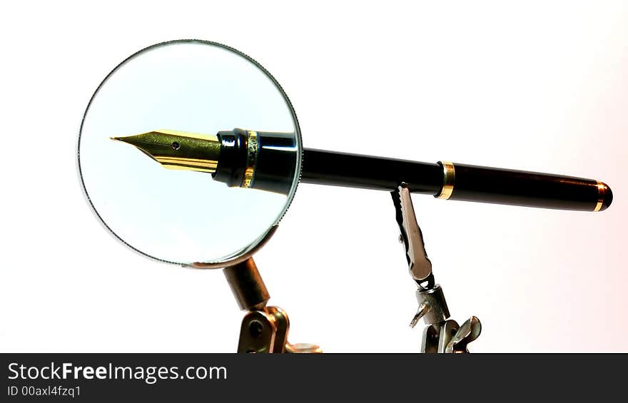 Look on a pen through the magnifying glass. Look on a pen through the magnifying glass