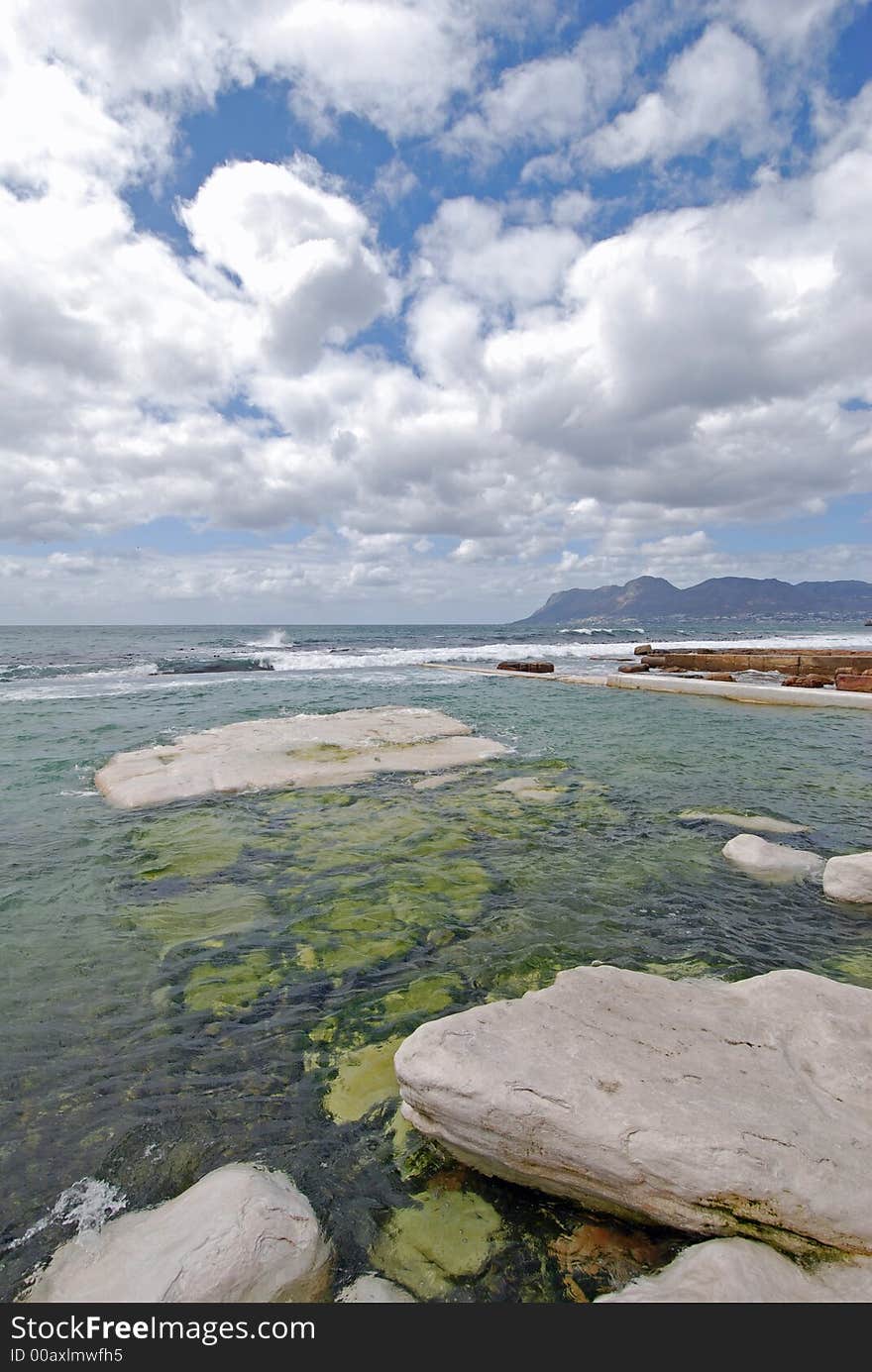 Rockpool With Cloudscape