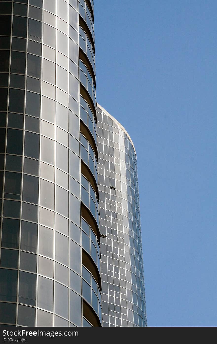 Modern skyscrapers against a bright blue sky