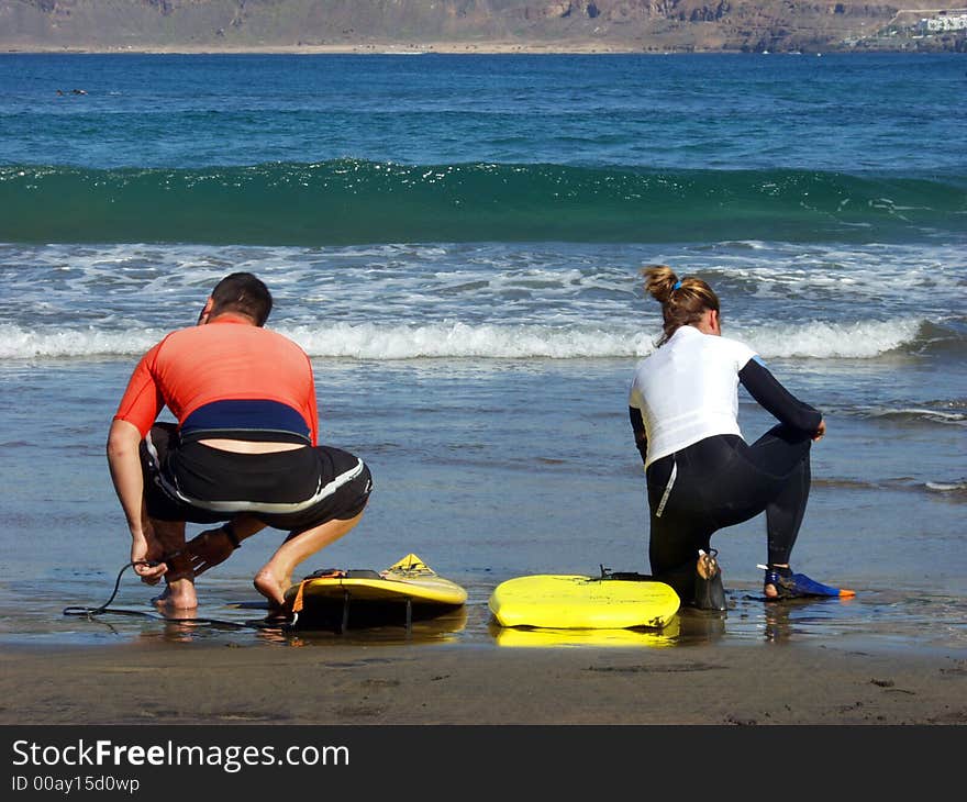 Two young surfers preparing for ride in the weaves