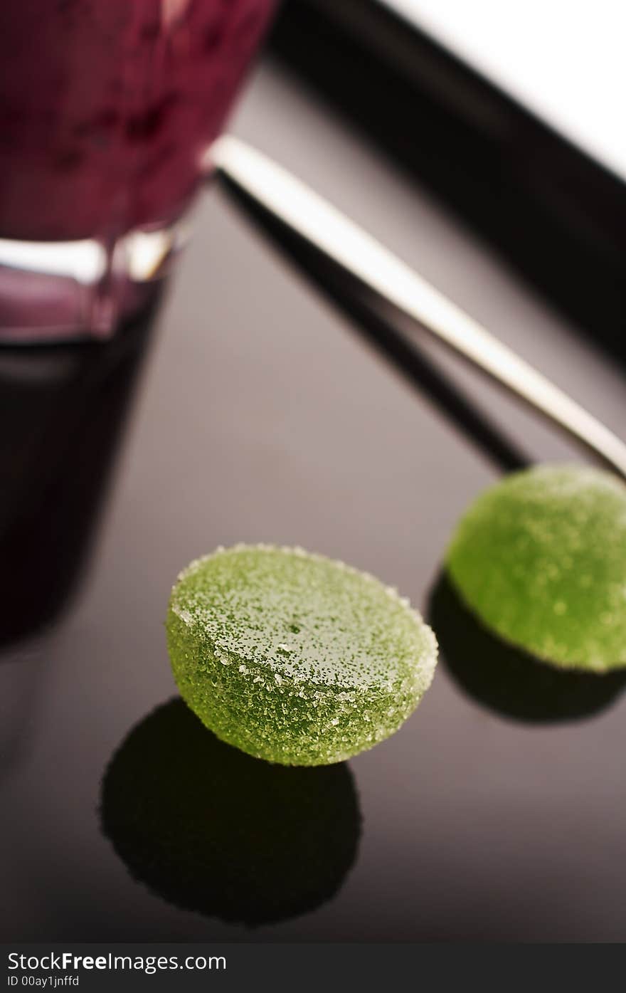 Green marmalade ball on the desert plate