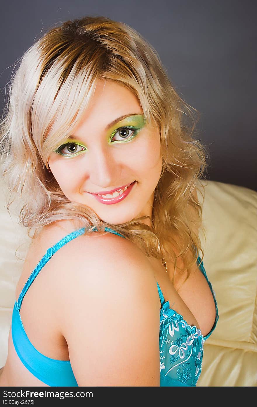 Beautiful young woman with green  eyes smiling