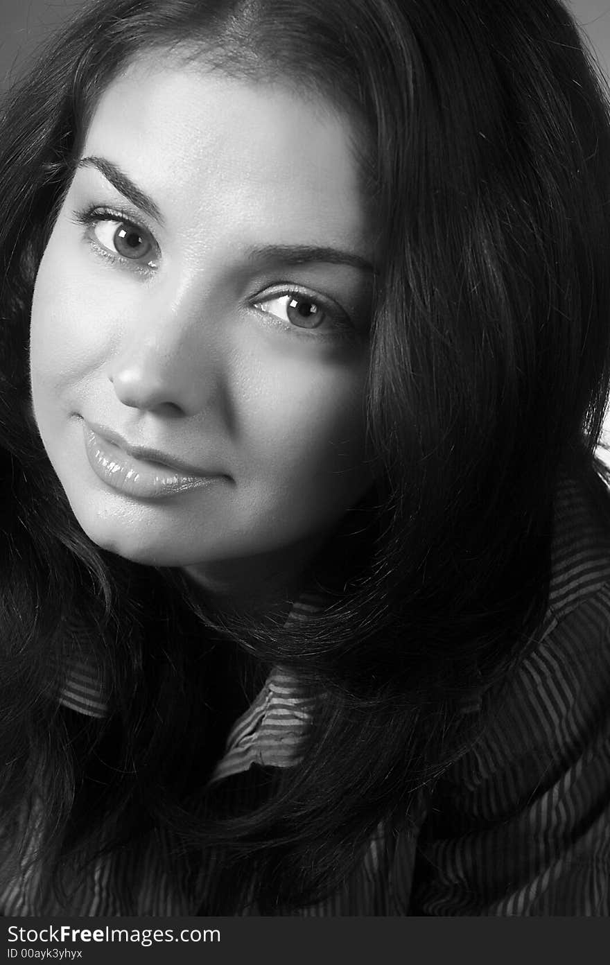 Closeup portrait of friendly brunette woman