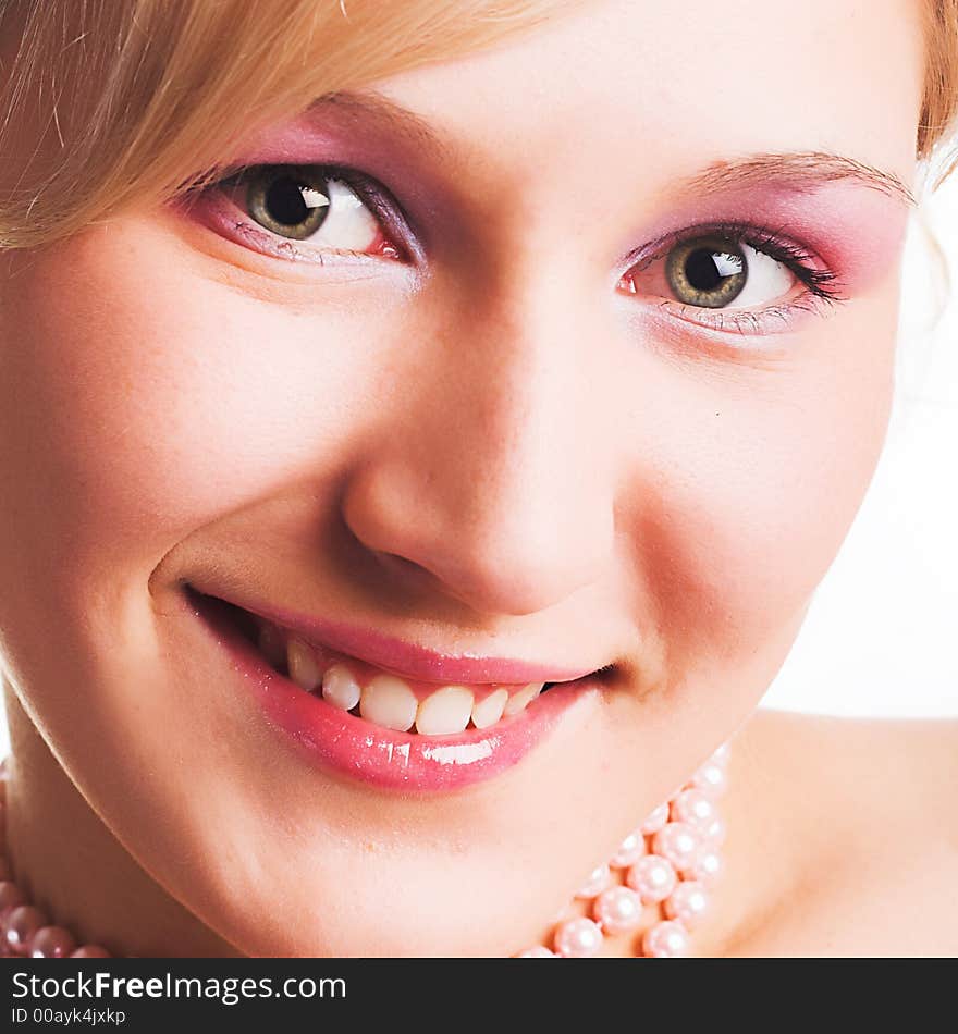 Beautiful young woman with green  eyes smiling