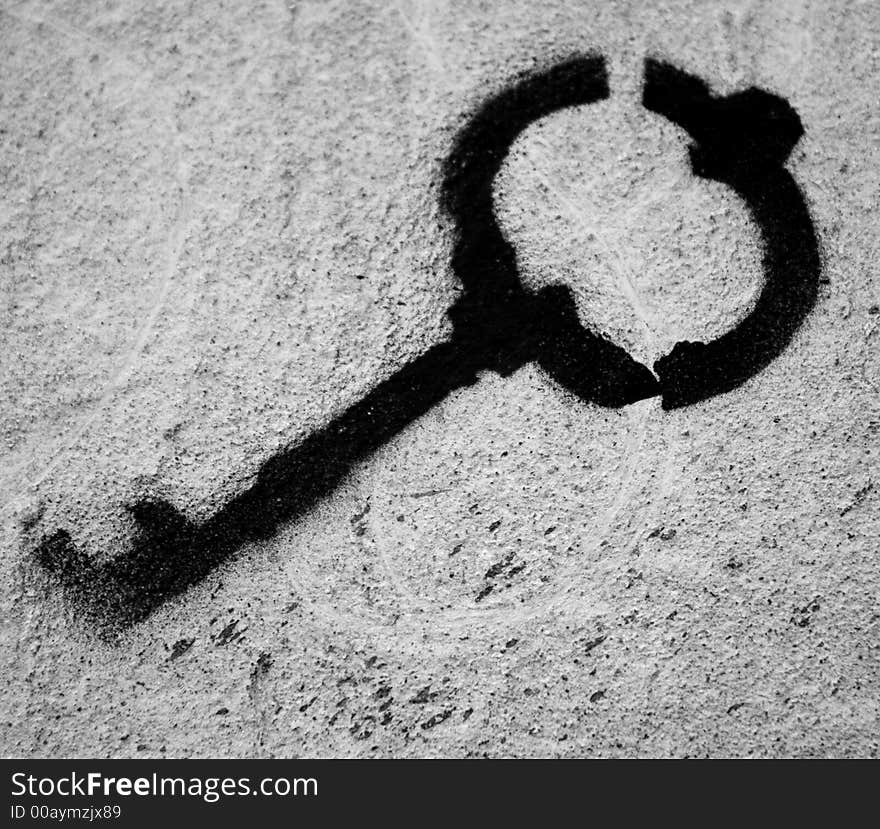 This is black paint image of key on the wall