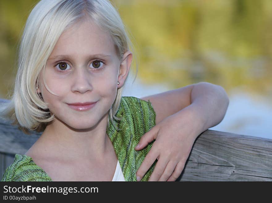 A close-up portrait of a girl smiling. A close-up portrait of a girl smiling