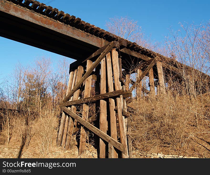 Wooden railroad bridge cross beams. Wooden railroad bridge cross beams