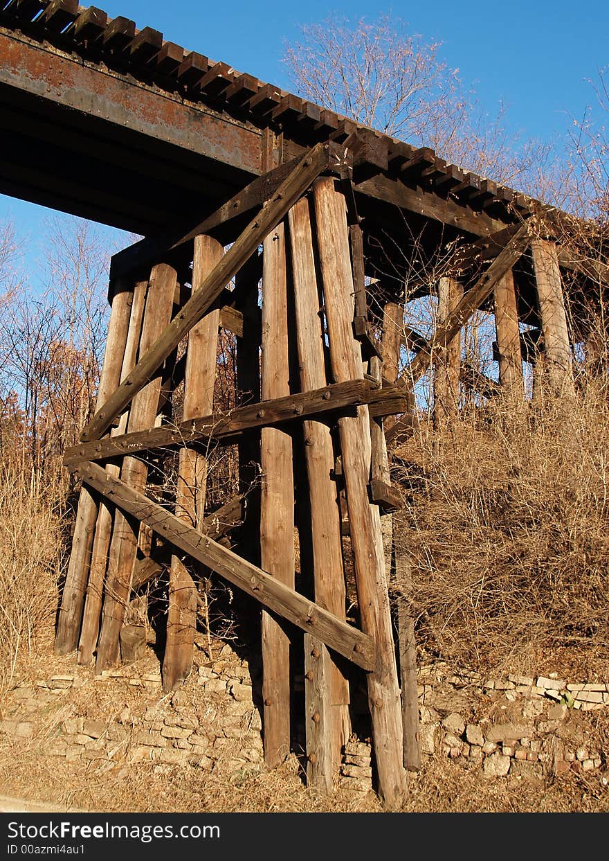 Wooden railroad bridge cross beams. Wooden railroad bridge cross beams