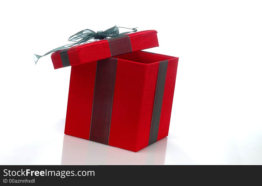 A white box with a green ribbon against a white background. A white box with a green ribbon against a white background.