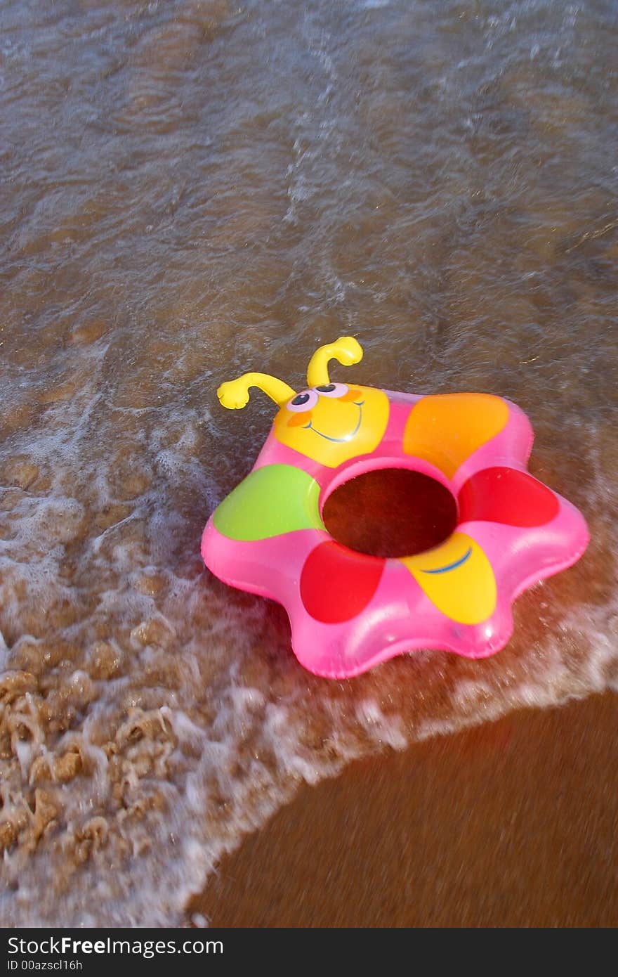 Partial view of a wave and a swimring in the bay of San Agustinillo in the southern state of Oaxaca in  Mexico, Latin America. Partial view of a wave and a swimring in the bay of San Agustinillo in the southern state of Oaxaca in  Mexico, Latin America